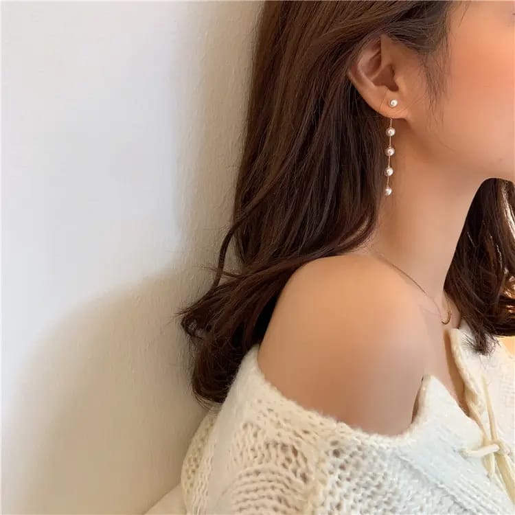 Aretes largos de 5 perlas