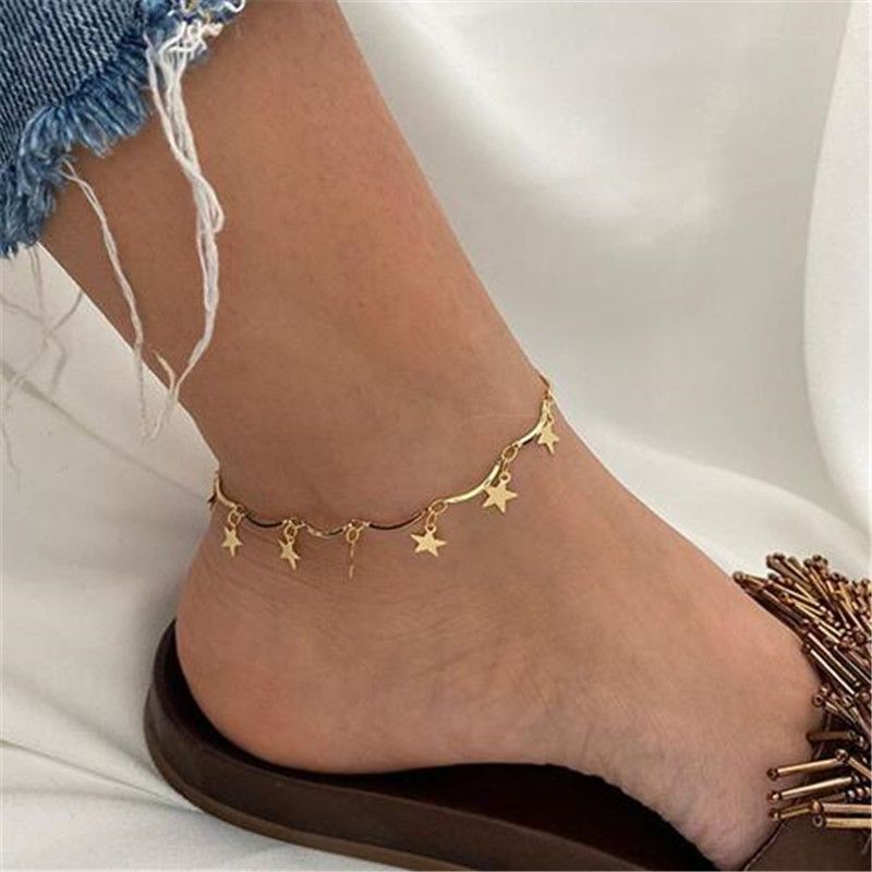Tobillera dorada con estrellas