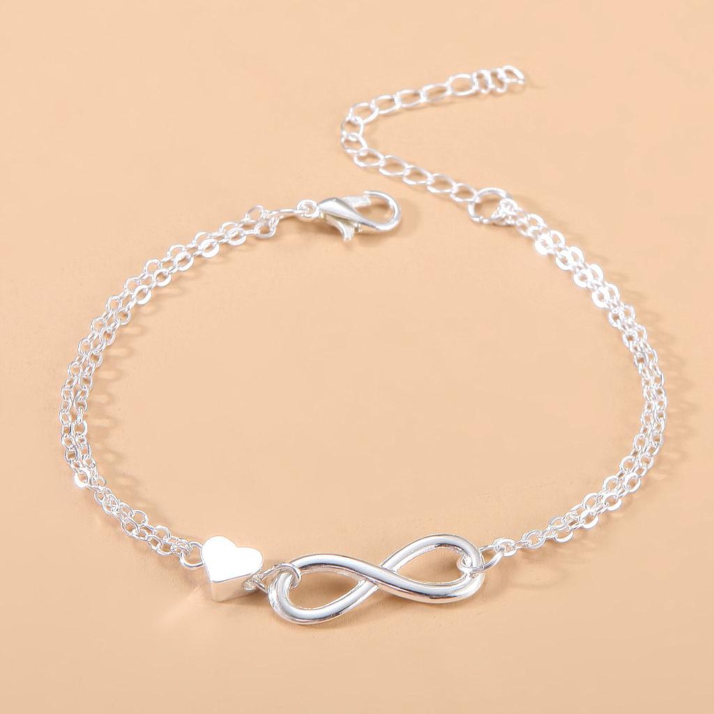 Pulsera plateada de infinito con corazón
