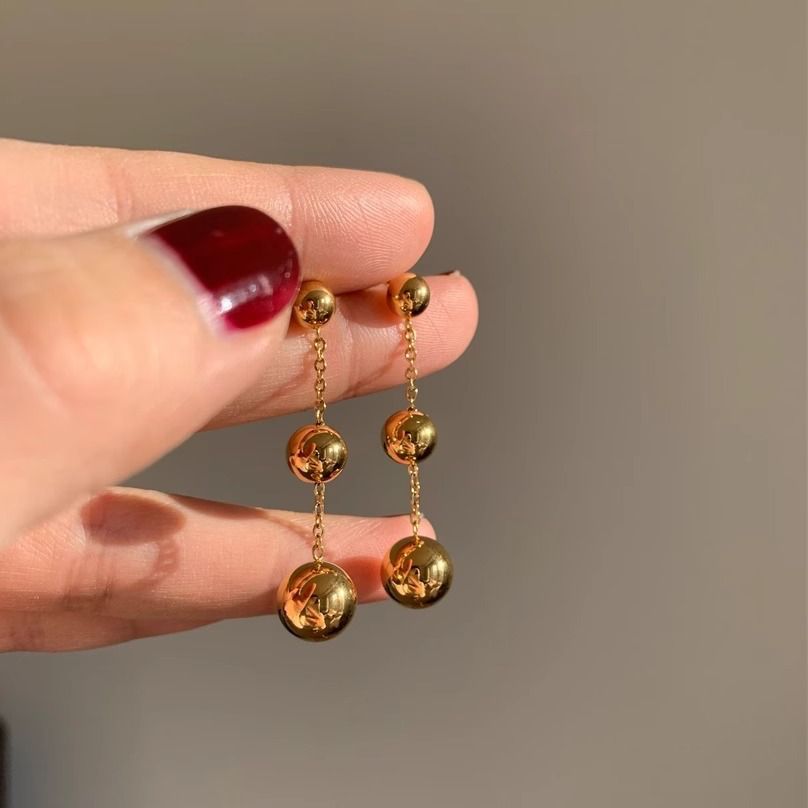 Aretes largos dorados